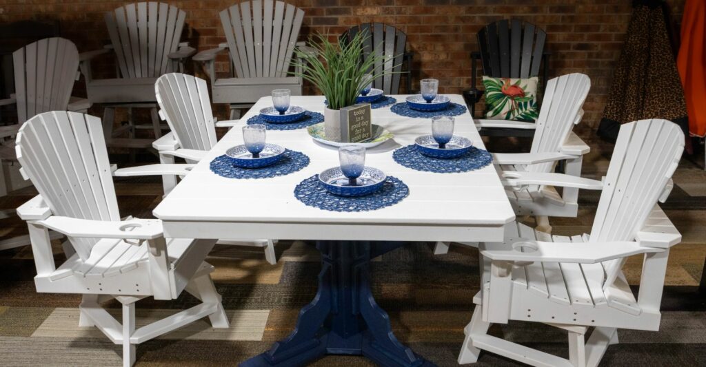 a white and blue table with white chairs