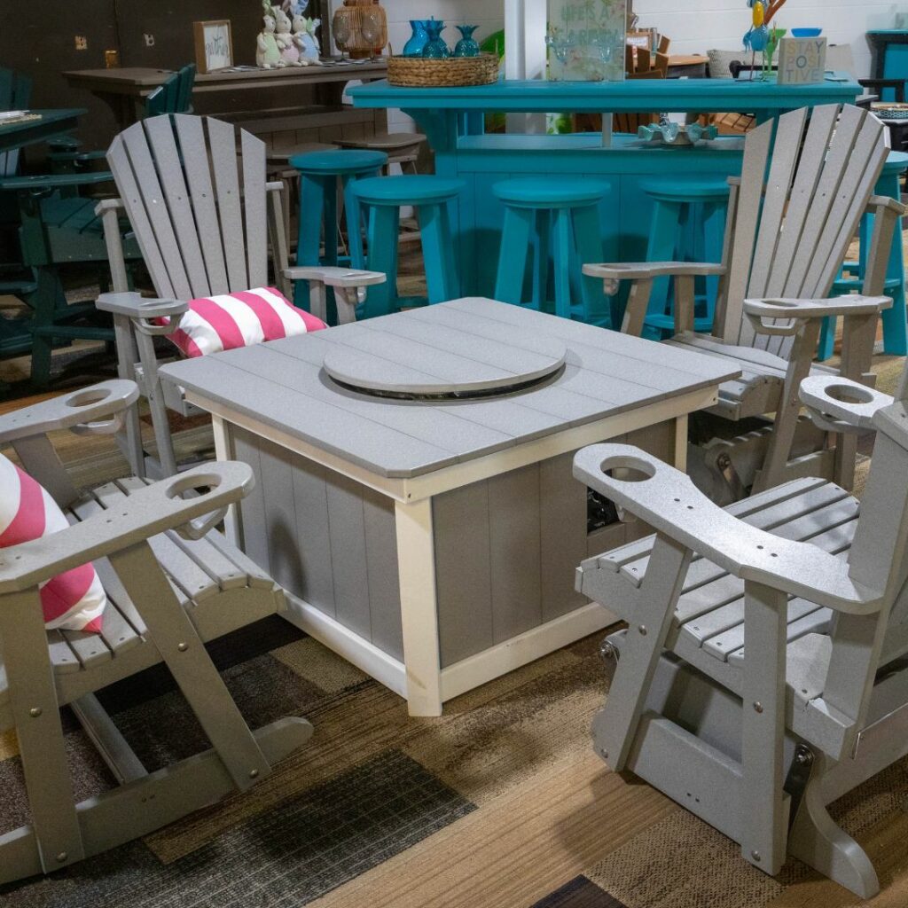 Gray outdoor chairs around a square fire pit